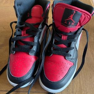 Air Jordan Mid, Size 4. Excellent condition. Worn only a couple times. No box.